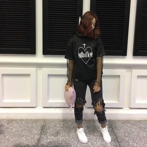 Black gray jeans. Opened-knees